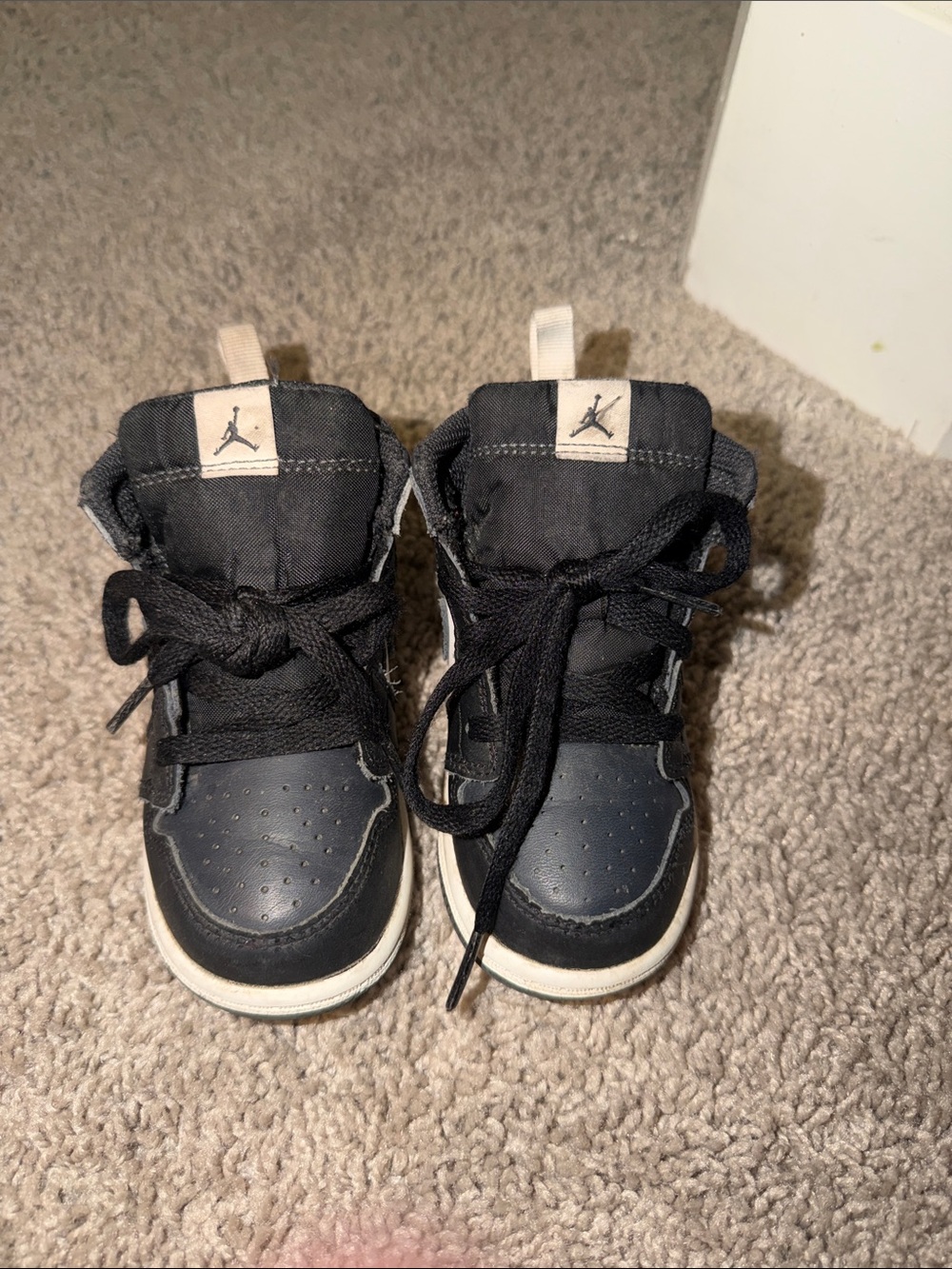Jordan Kids Black and White High-Top Sneakers with Jumpman Tab